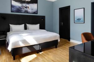 Postel nebo postele na pokoji v ubytování Radisson Blu 1919 Hotel, Reykjavík
