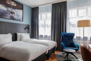 Postel nebo postele na pokoji v ubytování Radisson Blu 1919 Hotel, Reykjavík