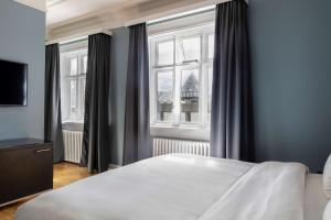 Postel nebo postele na pokoji v ubytování Radisson Blu 1919 Hotel, Reykjavík
