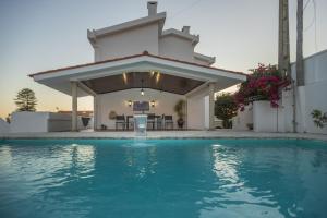 a house with a swimming pool in front of a house at Casa de Âncora in Vila Praia de Âncora
