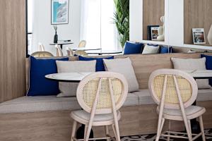 a cafe with two chairs and a table at Le Riviera Collection, Signature Collection by Best Western in Nice