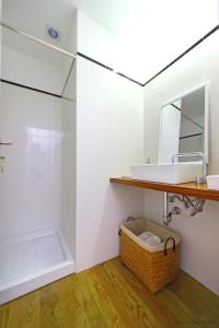 a bathroom with a sink and a shower at Oporto River and Ribeira Views in Vila Nova de Gaia +23 photos