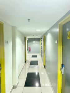 a hallway in a building with ailed floor at Hotel Living at Dsulaiman Near to Kampung Baru, Chow Kit, Kuala Lumpur in Kuala Lumpur