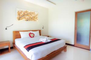 Voodi või voodid majutusasutuse Puri Canggu Rooms ll toas