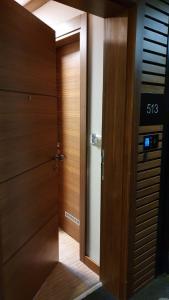 a wooden door with a sign on the side of it at Apartment B513 in Jahorina