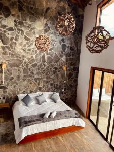 Ein Bett oder Betten in einem Zimmer der Unterkunft Hotel Campestre Palmas del Zamorano