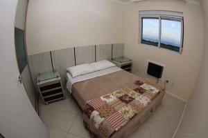 Una cama o camas en una habitación de Ingleses Ocean View