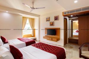 Cama o camas de una habitación en Moois Residency