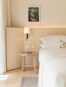Кровать или кровати в номере LUX* Le Morne Resort