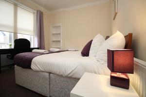Ένα ή περισσότερα κρεβάτια σε δωμάτιο στο 2 bed flat, Cambuslang, Glasgow, free parking