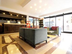 a lobby with couches and chairs in a store at Montania Town Hotel Mudanya in Mudanya