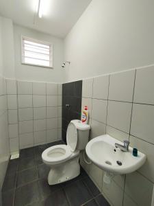 a bathroom with a toilet and a sink at Zaara Homestay Krubong Alor Gajah Ayer Keroh Melaka in Malacca