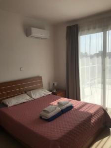 Postel nebo postele na pokoji v ubytování Coral Bay Villa 7, walking distance to the beach + 4 fotografie