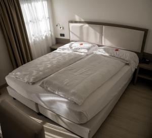 Postel nebo postele na pokoji v ubytování Hotel Garnì Villa Fontana