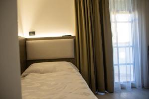 Postel nebo postele na pokoji v ubytování Hotel Garnì Villa Fontana