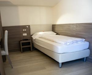 Postel nebo postele na pokoji v ubytování Hotel Garnì Villa Fontana