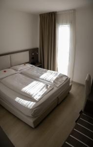 Postel nebo postele na pokoji v ubytování Hotel Garnì Villa Fontana