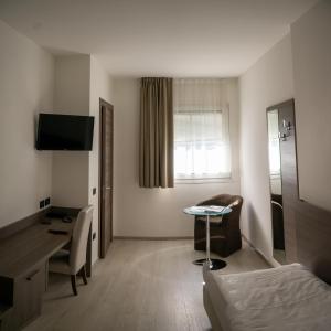 TV a/nebo společenská místnost v ubytování Hotel Garnì Villa Fontana