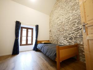 Postel nebo postele na pokoji v ubytování Gîte de Crémieu