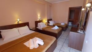 Postel nebo postele na pokoji v ubytování Hotel Lito