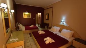 Postel nebo postele na pokoji v ubytování Hotel Lito + 37 fotografií