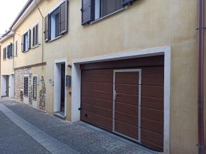 a garage door on the side of a building at Casa di nonna Marianna in Baunei
