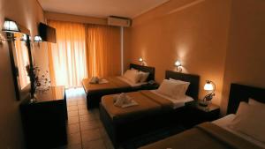 Postel nebo postele na pokoji v ubytování Hotel Lito