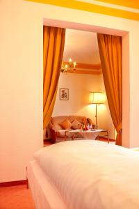 Postel nebo postele na pokoji v ubytování Hotel Luitpold