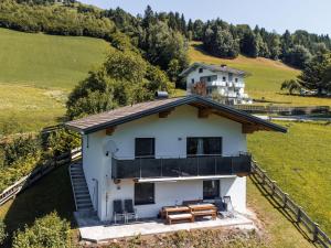 an aerial view of a house in a field at Holiday Home Pfisterer - BRG150 by Interhome in Taxenbach