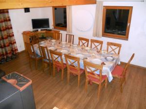 a dining room with a long table and chairs at Holiday Home Auer - EBE116 by Interhome in Eben im Pongau