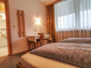 Łóżko lub łóżka w pokoju w obiekcie Holiday Home Kainer by Interhome