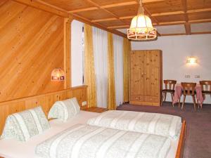 Łóżko lub łóżka w pokoju w obiekcie Holiday Home Kainer by Interhome