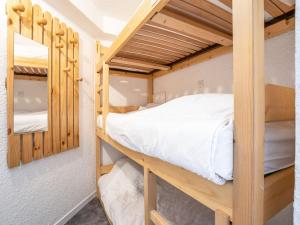a bedroom with bunk beds in a dorm room at Apartment Trois Vallées 516 by Interhome in Val Thorens
