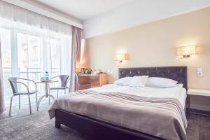 Кровать или кровати в номере Continental Forum Constanta