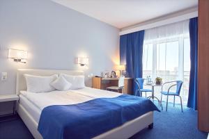 Кровать или кровати в номере Continental Forum Constanta