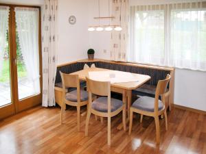 a dining room with a table and chairs at Apartment Eberharter - MHO154 by Interhome in Mayrhofen