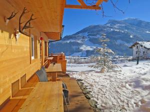 a wooden deck with a view of a mountain at Chalet Talbach - MHO778 by Interhome in Laimach
