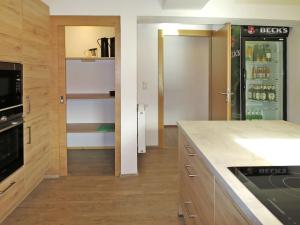 A kitchen or kitchenette at Chalet Talbach by Interhome Még 37 kép