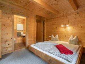 A bed or beds in a room at Chalet Talbach by Interhome