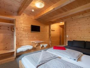 A bed or beds in a room at Chalet Talbach by Interhome