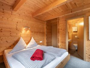 A bed or beds in a room at Chalet Talbach by Interhome