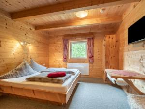 A television and/or entertainment centre at Chalet Talbach by Interhome