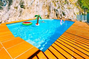 a swimming pool with a toy in the water at Villa Eris Amalfi Coast in Conca dei Marini
