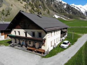 a house with a car parked in front of it at Holiday Home Mucherhof by Interhome in Hochmark