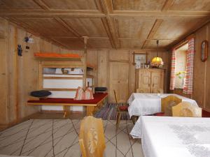 a living room with two beds and a table at Holiday Home Mucherhof by Interhome in Hochmark