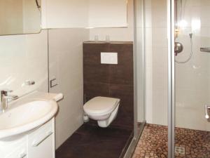 A bathroom at Apartment Leonie by Interhome
