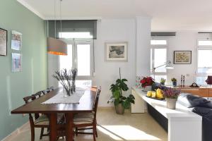 A seating area at Apartment El Confital RF18 by VillaGranCanaria