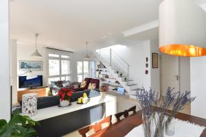 A seating area at Apartment El Confital RF18 by VillaGranCanaria