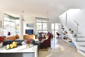 A seating area at Apartment El Confital RF18 by VillaGranCanaria