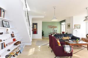 A seating area at Apartment El Confital RF18 by VillaGranCanaria